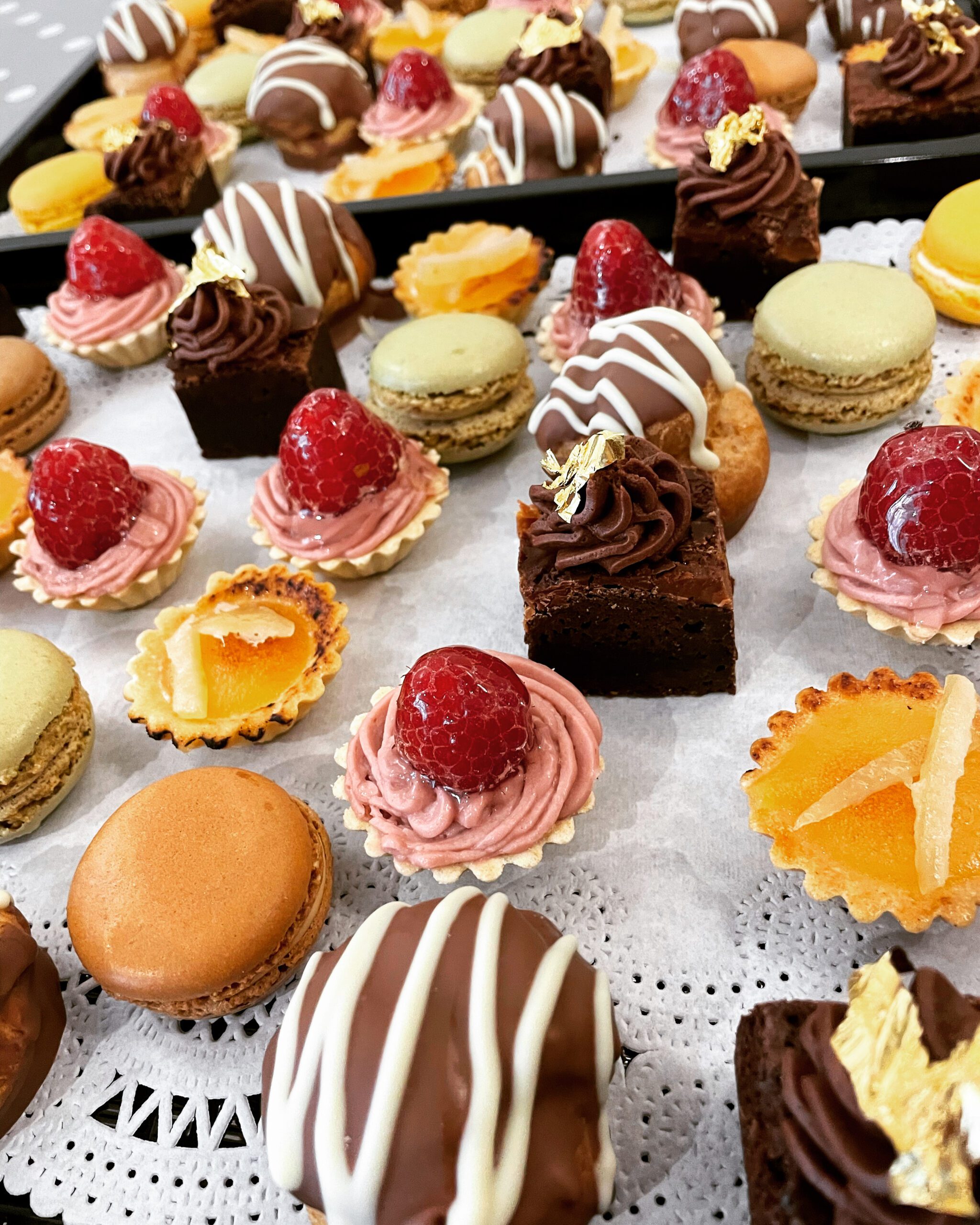 A tray filled with a variety of desserts